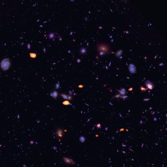 Abbildung 1: Das Hubble Ultra Deep Field (HUDF) zeigte sich dem Atacama Large Millimeter/submillimeter Array (ALMA) als Fundgrube von Galaxien, die reich an Kohlenmonoxid sind (orange) und damit Potenzial für Sternentstehung haben. Abbildung 1: Das Hubble Ultra Deep Field (HUDF) zeigte sich dem Atacama Large Millimeter/submillimeter Array (ALMA) als Fundgrube von Galaxien, die reich an Kohlenmonoxid sind (orange) und damit Potenzial für Sternentstehung haben.